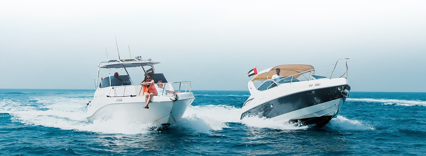 Two Xclusive Boat Club boats cruising off Dubai