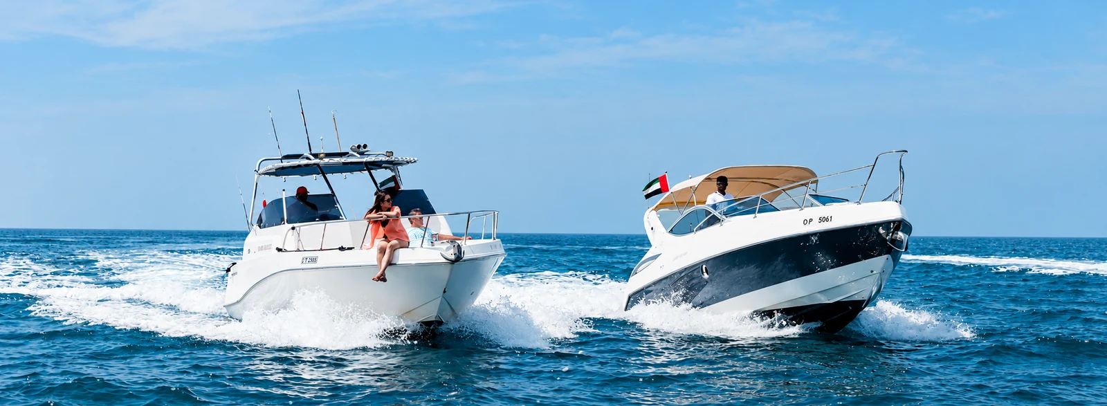 Two Xclusive boats cruising on open water